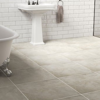 bathroom with tan tile floor