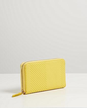 oliver bonas yellow purse