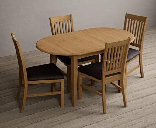 Solid oak oval dining discount table and chairs