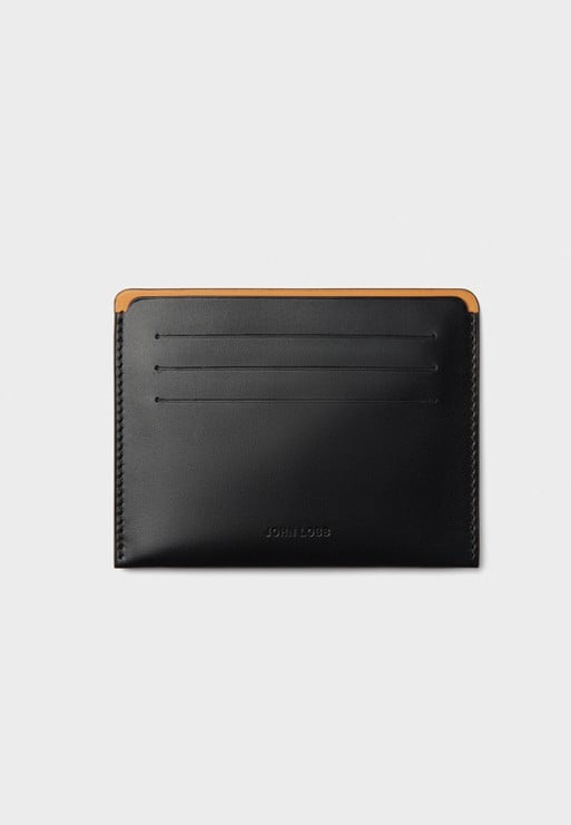 Sold . Crafted entirely in smooth black calfskin, this versatile